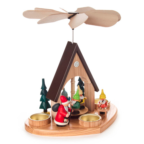 Authentic German Pyramids ON SALE! | Features: handcrafted Santa, 4 Elves each making their own craft, hand-painted clock at the top of the house, and 3 brass tealight candle holders. USE: Place the candle in the designated holders on the pyramid. Heat from the candle will slowly cause the blades to rotate. | 1-Tier Santa and Elves Pyramid, 10" 085/P/1013/D | Handmade in the Erzgebirge region of Seiffen, Germany | Lindenhaus Imports in Helen, Ga Authentic German Pyramids ON SALE! | Features: handcrafted Santa, 4 Elves each making their own craft, hand-painted clock at the top of the house, and 3 brass tealight candle holders. USE: Place the candle in the designated holders on the pyramid. Heat from the candle will slowly cause the blades to rotate. | 1-Tier Santa and Elves Pyramid, 10" 085/P/1013/D | Handmade in the Erzgebirge region of Seiffen, Germany | Lindenhaus Imports in Helen, Ga