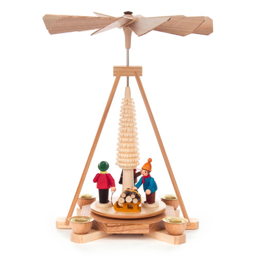 Authentic German Pyramids ON SALE! | Features three handcrafted woodsmen: 1 carrying kinlin, 1 loading the wood onto the sled, and 1 holding the rope to the sled; intricate rotating tree in center, and 4 brass tealight candle holders. USE: place the candle in the designated holders on the pyramid. Heat from the candle will slowly cause the blades to rotate. | 1-Tier Waldleuten (Woodsmen), 10" 085/P/484/D/5 | Handmade in the Erzgebirge region of Seiffen, Germany | Lindenhaus Imports in Helen, Ga