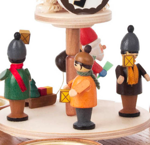 Authentic German Pyramids ON SALE! | Features handcarved Santa with 3 children holding lanterns on the lower turntable, 2 riders on rocking horses on the upper turntable, intricate trees throughout, and 4 premium brass tealight candle holders. USE: Place the candle in the designated holders on the pyramid. Heat from the candle will slowly cause the blades to rotate. | 2-Tier Santa with Lantern Children and Rocking Horses, 9" 085/P/528/D | Handmade in the Erzgebirge region of Seiffen, Germany | Lindenhaus Imports in Helen, Ga Authentic German Pyramids ON SALE! | Features handcarved Santa with 3 children holding lanterns on the lower turntable, 2 riders on rocking horses on the upper turntable, intricate trees throughout, and 4 premium brass tealight candle holders. USE: Place the candle in the designated holders on the pyramid. Heat from the candle will slowly cause the blades to rotate. | 2-Tier Santa with Lantern Children and Rocking Horses, 9" 085/P/528/D | Handmade in the Erzgebirge region of Seiffen, Germany | Lindenhaus Imports in Helen, Ga