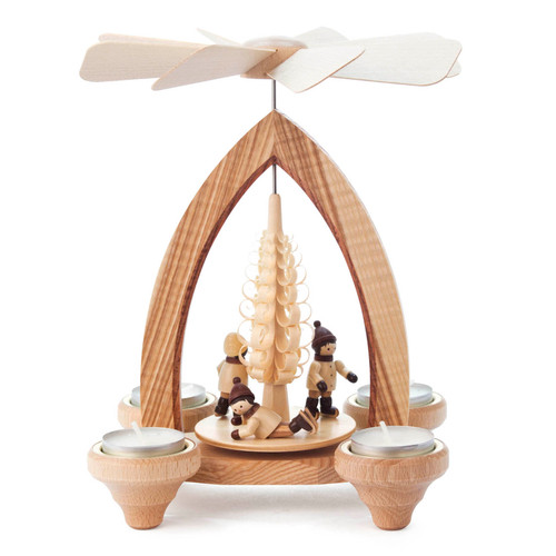 Authentic German Pyramids ON SALE! | Features 3 handcarved ice skaters on the lower turntable, intricate wooden tree carving in the middle, and 4 brass tealight candle holders. USE: Place the candle in the designated holders on the pyramid. Heat from the candle will slowly cause the blades to rotate. | 1-Tier Eisläufern (Ice Skaters), 9" 085/P/624/D | Handmade in the Erzgebirge region of Seiffen, Germany | Lindenhaus Imports in Helen, Ga