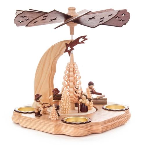 Authentic German Pyramids ON SALE! | Features five handcarved forest workers: 1 sawing logs, 2 carrying kinlin, 1 sawing logs with a chainsaw, and 1 petting a dog; intricate trees made from shavings throughout with curved design outlining 4 brass candle holders. USE: Place the candle in the designated holders on the pyramid. Heat from the candle will slowly cause the blades to rotate. | 1-Tier Waldarbeiter (Forest Workers), 9" 085/P/999/D/2 | Handmade in the Erzgebirge region of Seiffen, Germany | Lindenhaus Imports in Helen, Ga Authentic German Pyramids ON SALE! | Features five handcarved forest workers: 1 sawing logs, 2 carrying kinlin, 1 sawing logs with a chainsaw, and 1 petting a dog; intricate trees made from shavings throughout with curved design outlining 4 brass candle holders. USE: Place the candle in the designated holders on the pyramid. Heat from the candle will slowly cause the blades to rotate. | 1-Tier Waldarbeiter (Forest Workers), 9" 085/P/999/D/2 | Handmade in the Erzgebirge region of Seiffen, Germany | Lindenhaus Imports in Helen, Ga