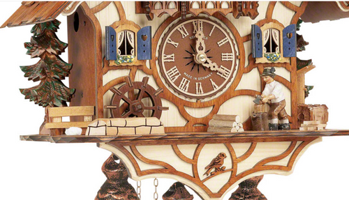 This exquisite clock features intricately carved details, showcasing a whimsical scene of a woodchopper cheerfully raising his axe, surrounded by the natural beauty of the Black Forest.