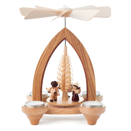 Authentic German Pyramids ON SALE! | Features three handcarved merchant figures on the lower turntable: 1 with a detailed Christmas pyramid, 1 holding a rocking horse and bell, and 1 showing a pretzel and hand-painted heart; intricate rotating tree in center with 4 brass tealight candle holders.
USE: Place the candle in the designated holders on the pyramid. Heat from the candle will slowly cause the blades to rotate. | 1-Tier Handelsleuten (Merchants), 9" 085/P/666/D | Handmade in the Erzgebirge region of Seiffen, Germany | Lindenhaus Imports in Helen, Ga Authentic German Pyramids ON SALE! | Features three handcarved merchant figures on the lower turntable: 1 with a detailed Christmas pyramid, 1 holding a rocking horse and bell, and 1 showing a pretzel and hand-painted heart; intricate rotating tree in center with 4 brass tealight candle holders.
USE: Place the candle in the designated holders on the pyramid. Heat from the candle will slowly cause the blades to rotate. | 1-Tier Handelsleuten (Merchants), 9" 085/P/666/D | Handmade in the Erzgebirge region of Seiffen, Germany | Lindenhaus Imports in Helen, Ga