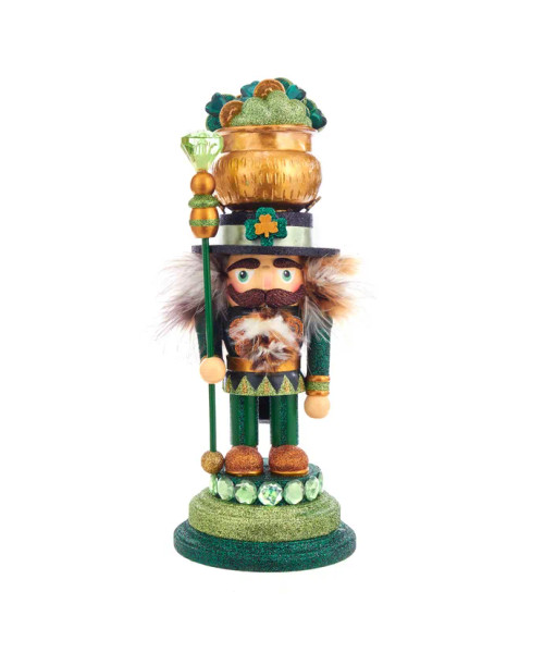 Front view features green and gold glitter on an emerald base. In his right hand he's holding an emerald gem topped staff. His hat is his lucky pot o' gold complete with glittered shamrocks and gold pieces. Front view features green and gold glitter on an emerald base. In his right hand he's holding an emerald gem topped staff. His hat is his lucky pot o' gold complete with glittered shamrocks and gold pieces.