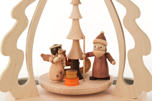 Authentic German Pyramids ON SALE! | Features: handcarved Santa, Angel, and presents on the rotor, curved wooden side accents, and 3 premium metal tealight candle holders. USE: Place the candle in the designated holders on the pyramid. Heat from the candle will slowly cause the blades to rotate. | 1-Tier Santa and Angel Bescherung Pyramid, 10" 085/P/885/D | Handmade in the Erzgebirge region of Seiffen, Germany | Lindenhaus Imports in Helen, Ga Authentic German Pyramids ON SALE! | Features: handcarved Santa, Angel, and presents on the rotor, curved wooden side accents, and 3 premium metal tealight candle holders. USE: Place the candle in the designated holders on the pyramid. Heat from the candle will slowly cause the blades to rotate. | 1-Tier Santa and Angel Bescherung Pyramid, 10" 085/P/885/D | Handmade in the Erzgebirge region of Seiffen, Germany | Lindenhaus Imports in Helen, Ga