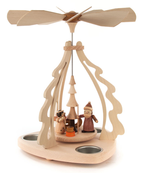 The frame, made from light wood and shaped like a Christmas tree, holds brightly glazed figures.