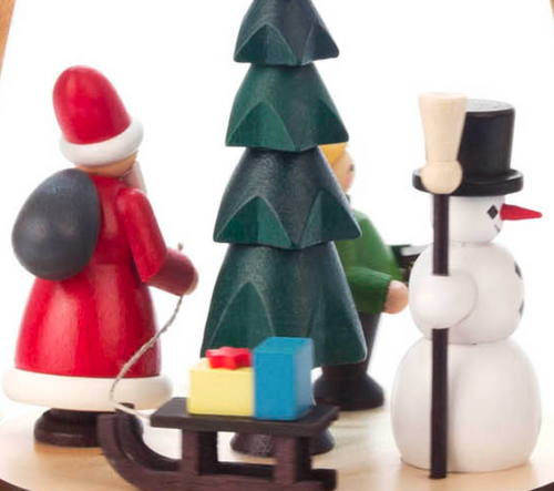 Authentic German Pyramids ON SALE! | Features three handcarved Christmas time figures on the lower turntable: 1 Santa pulling a sled full of presents, 1 Snowman with classic carrot nose and broom stick, and 1 figure leading the way with a handcrafted lantern; hand-painted rotating tree in center with 4 brass candle holders. | 1-Tier Weihnachtszeit (Christmas Time), 10" 085/P/324/D/B | Handmade in the Erzgebirge region of Seiffen, Germany | Lindenhaus Imports in Helen, Ga Authentic German Pyramids ON SALE! | Features three handcarved Christmas time figures on the lower turntable: 1 Santa pulling a sled full of presents, 1 Snowman with classic carrot nose and broom stick, and 1 figure leading the way with a handcrafted lantern; hand-painted rotating tree in center with 4 brass candle holders. | 1-Tier Weihnachtszeit (Christmas Time), 10" 085/P/324/D/B | Handmade in the Erzgebirge region of Seiffen, Germany | Lindenhaus Imports in Helen, Ga