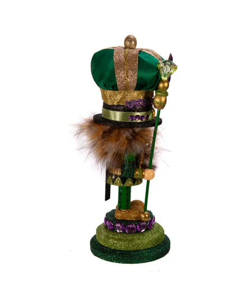Side view features green, purple, and gold glitter and gem detailing. Side view features green, purple, and gold glitter and gem detailing.