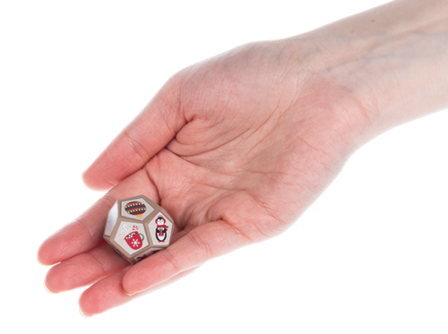 View of the 12 Acts of Kindness Christmastime Challenge Dice in palm of hand