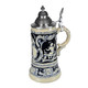 Thewalt 1893 'Fridolin the Drunken Son' Beer Stein T1341/EZ | Features shield and cherubs with musical instruments on both sides | Thewalt 1893 Collection | 'Fridolin the Drunken Son' Stein, 0.75L | Lindenhaus Imports in Helen, Ga