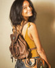 Green Stone & Leather Backpack Lifestyle Shot With Model