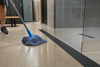 SafetyMark Coarse Resilient anti-slip tape on a gym floor being cleaned with a mop, showing its mop-friendly surface