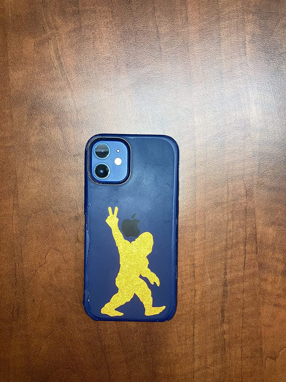 Bigfoot peace- hand-sign, yellow,  vinyl sticker on cell phone.
