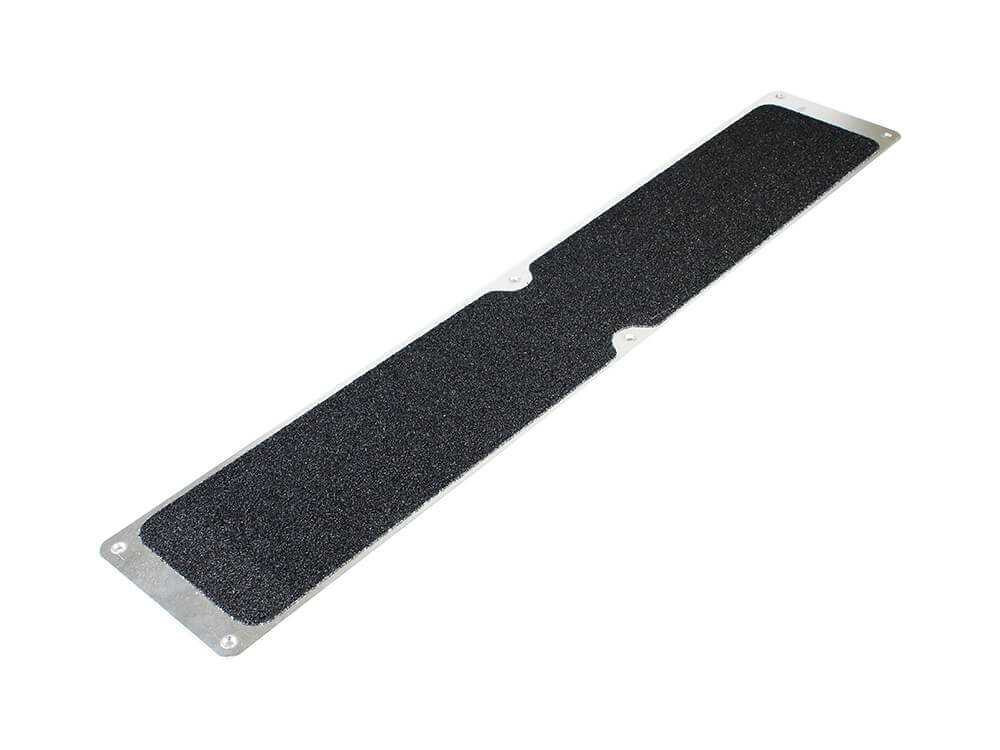 Heskins H3416 / H3409 Bolt Down Anti-Slip Plate close-up showing Coarse Safety-Grip surface and pre-drilled countersunk mounting holes — aluminum plate 4.5"x25" size shown