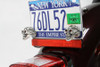V-Twin #13-1225 - Skull with Skeleton Hand License Plate Topper Set