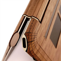 HP Spectre 2023 13.5" 2-in-1 laptop, detail image in Rosewood real wood cover. Lightning port. 