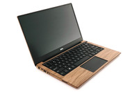 Dell XPS 13" wood trackpad surround by Toastmade.  Details vary by model.