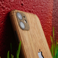 Toast iPhone 11 Pro wood cover in walnut, close-up.
