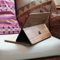 Toast wood cover for Microsoft Surface Laptop Studio in walnut, lifestyle.