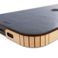 Detail of genuine leather wrap with Toast wood side covers, for iPhone 12, mini, 12 Pro, and 12 Pro Max.  Pictured in Navy Grog blue leather with maple wraps.