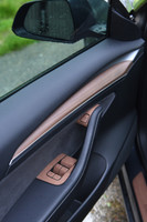 Tesla Model Y with a Wenge Door Sill and Door Switches 