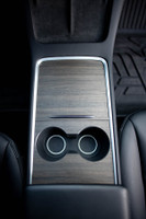 Tesla Model 3 Second Generation with ebony real wood covering the center console.