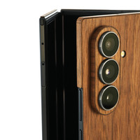 Detail shot of walnut cover for Trifold.