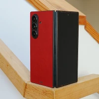 Toast leather and wood cover for Samsung Galaxy TriFold shown in cherry red and ebony.