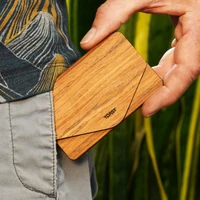 Lifestyle image of the amazingly light and pocketable bonsai wood wallet by Toast, shown in teak.