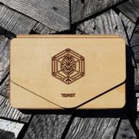 Custom engraving on a maple wood bonsai wallet by Toast.