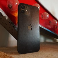 Grey leather back skin with ebony wraps for iPhone 14 by Toast.