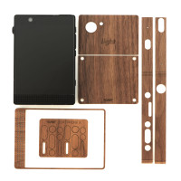 Toast's real wood cover for Light Phone is a kit of parts that you apply to the phone.  This keeps it slim, light and elegant while still adding a ton of grip and protection.