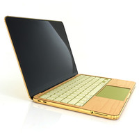 Detail of Toast cover from MacBook Neo, keyboard area in maple wood.