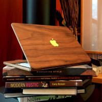 Lifestyle photo of MacBook wood cover in walnut.