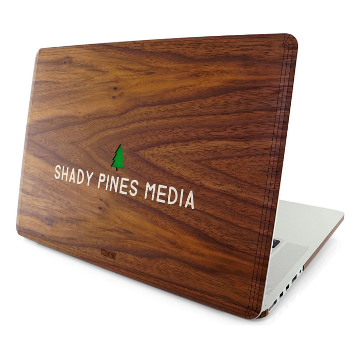 Custom engraved Toast MacBook cover in walnut with colored film and inlayed wood.