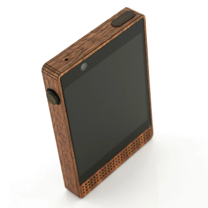Light Phone 3 wrapped in Toast real wood cover, walnut shown.