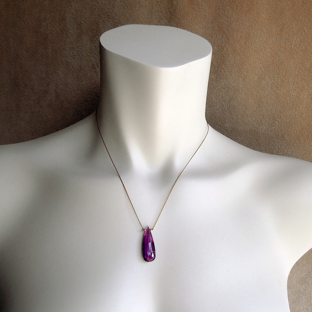 model is sporting the amethyst in the same size for reference