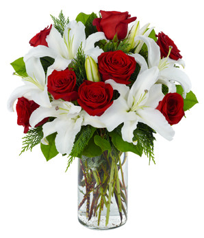 What a perfect present! Stunning white lilies and gorgeous red roses are a safe bet to bring Valentine's Day to life.