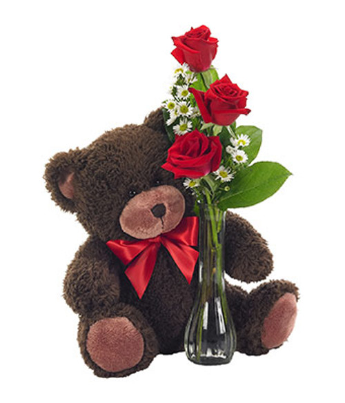 A cute Teddy Bear holding on to Three roses. A cute Teddy Bear holding on to Three roses.