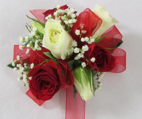 Beautiful Red and White Delight. Delicate design of red and white miniature spray rose with a sheer red ribbon. Dazzle her with this stunning design by Chappell's Florist