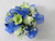 Beautiful Blue corsage designed with white orchids and white miniature spray roses with a touch of babies breath. Adorn her evening with this exclusive design by Chappells Florist.