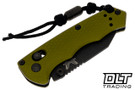 Benchmade Full Immunity in Woodland Green with a black Cerakote blade and lanyard grip extension with bead.