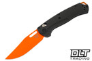 Benchmade Taggedout with carbon fiber handles and a orange coated blade. Benchmade Taggedout with carbon fiber handles and a orange coated blade.