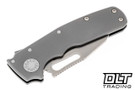 Demko Shark Cub with smooth titanium handles and a satin 20CV Shark Foot blade shown in the closed position. 