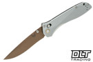 Benchmade 710 folding knife with gray aluminum handle and tan coated blade.