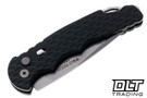 Black Pro-Tech TR-4 with Feather milling pattern and MagnaCut blade shown closed