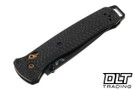 Benchmade 537BK-10 Bailout folding knife with Carbon Fiber handles and gold hardware with a black S90V Tanto blade