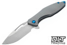 Koenig Mini Arius - Plexa Pattern Titanium - Burnished M390 Blade - Polished Flats - Blue Hardware