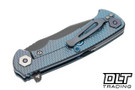 Hinderer Project X Clip Point MagnaCut - Battle Blue Titanium - Battle Black Blade - Arctic Storm Fat Carbon Scale - Blue Hardware