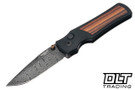 Hogue Saxum Manual - Drop Point Patterned Damascus Blade - Matte Black Aluminum - Kingwood Inlay - Collector Series